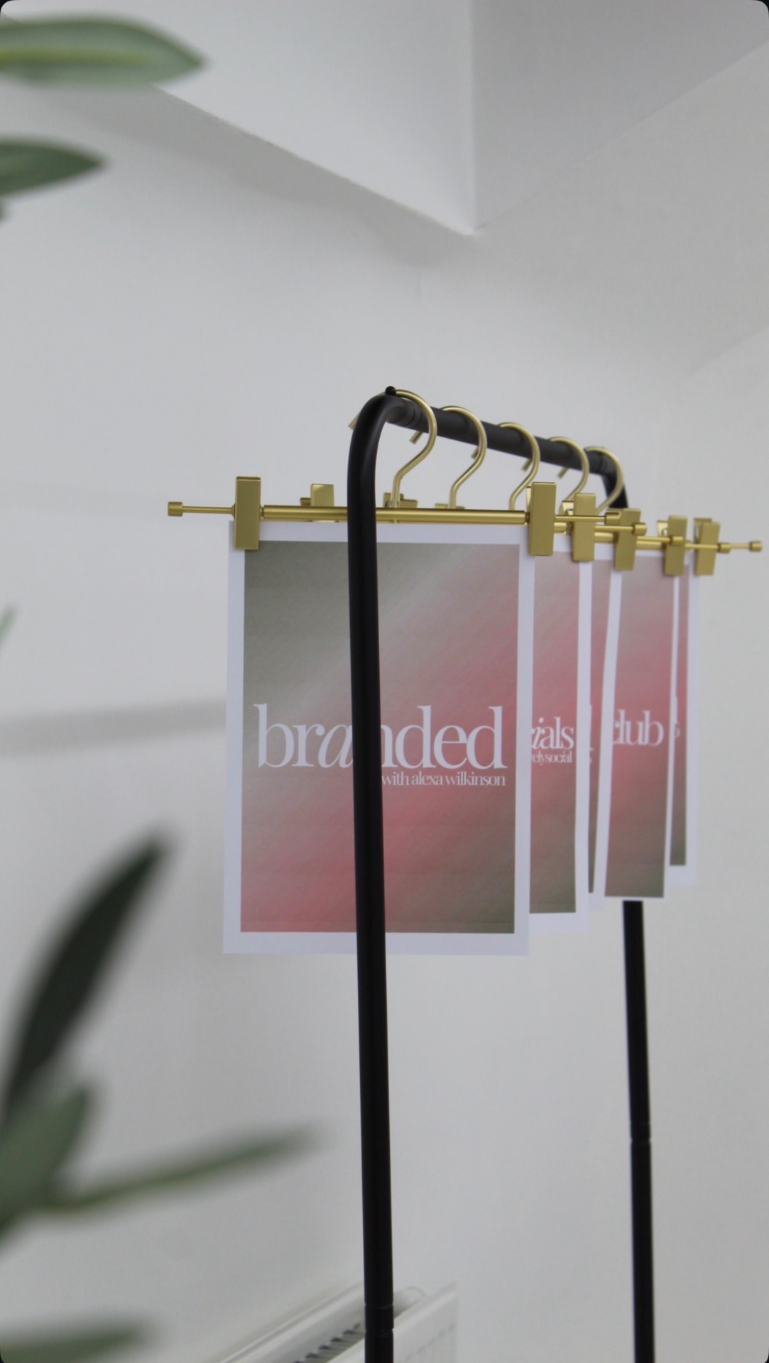Branded print display rail styled for product photography in Glasgow