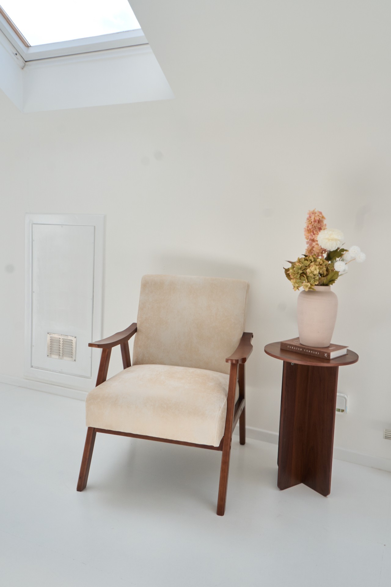 Mid-century armchair under skylight in our Glasgow content studio set