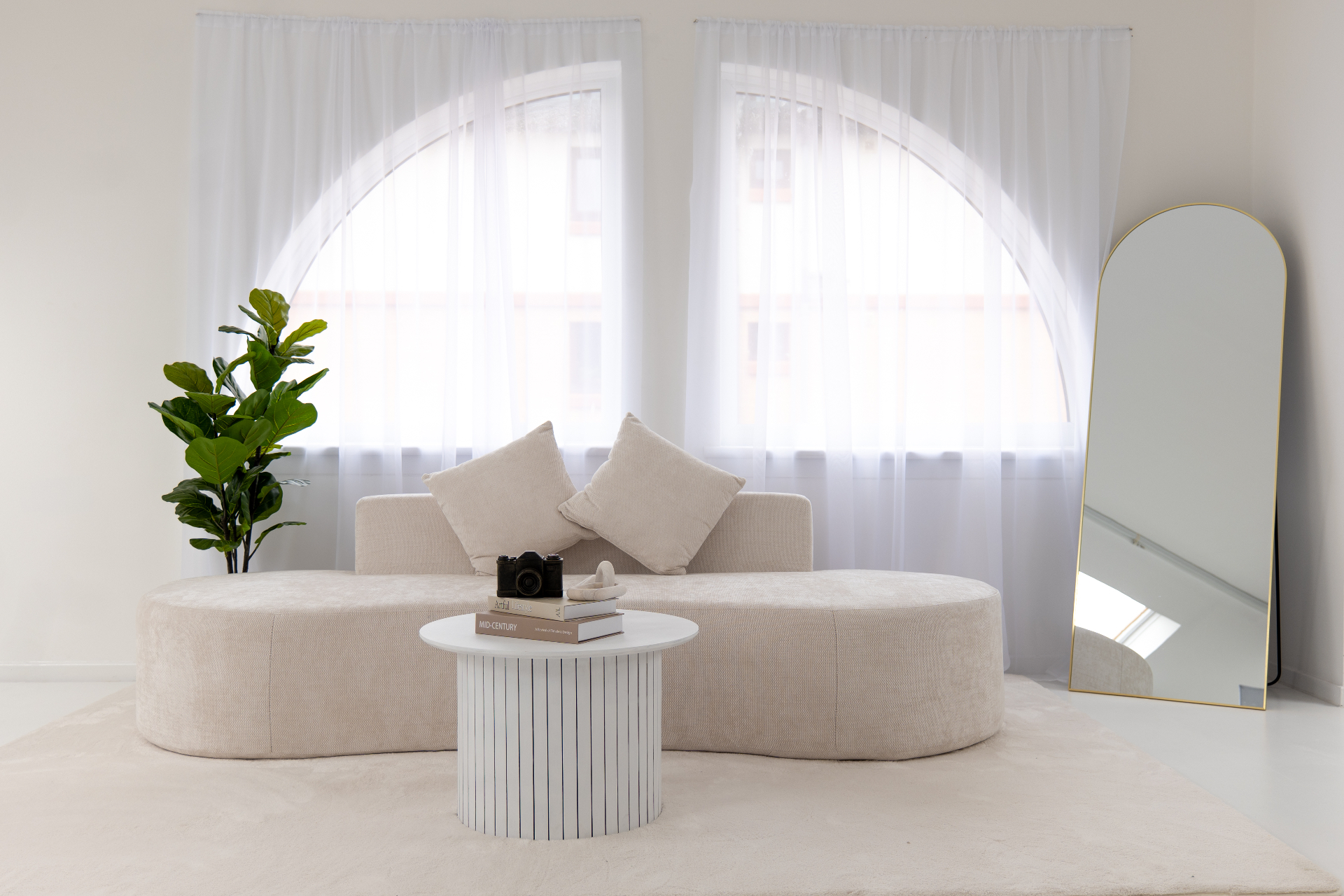 Arched window lounge set with cream sofa for content creation in Glasgow